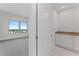 Bathroom view featuring tile flooring, sink with cabinet, and partial view of bedroom at 2910 W Barcelona St # 903, Tampa, FL 33629