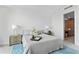 Cozy bedroom with neutral colors and minimalist design features plush bedding at 2910 W Barcelona St # 903, Tampa, FL 33629