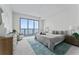 Bright bedroom features a large window with water views and modern decor at 2910 W Barcelona St # 903, Tampa, FL 33629