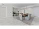 Dining room featuring marble floors, a large wooden table with seating for eight, and modern decor at 2910 W Barcelona St # 903, Tampa, FL 33629