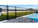 Exterior view of a gated dog park with green turf and a secure fence, perfect for pet owners at 2910 W Barcelona St # 903, Tampa, FL 33629