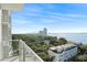 Scenic view from the balcony overlooking the city skyline, trees, and ocean at 2910 W Barcelona St # 903, Tampa, FL 33629