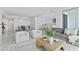 Inviting living room with modern furnishings, seamless flow to kitchen, dining area, and marble floors at 2910 W Barcelona St # 903, Tampa, FL 33629