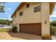 Brown garage door with side yard view at 4904 N Habana Ave, Tampa, FL 33614