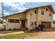 House exterior with brown garage door and landscaping at 4904 N Habana Ave, Tampa, FL 33614