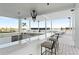 Outdoor kitchen with stainless steel appliances and seating area at 2910 W Barcelona St # 903, Tampa, FL 33629
