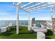 Tranquil rooftop lounge area with circular seating and water views at 2910 W Barcelona St # 903, Tampa, FL 33629