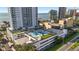 An aerial view of a building with a rooftop recreation area, including a basketball court at 2910 W Barcelona St # 903, Tampa, FL 33629