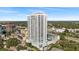 Aerial view of a modern highrise building near a highway and other buildings at 2910 W Barcelona St # 903, Tampa, FL 33629