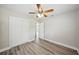 Large bedroom with hardwood floors and ceiling fan at 5725 Newton S Ave, Gulfport, FL 33707