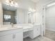 Double vanity bathroom with a walk-in closet and shower at 11218 Rustic Timber Loop, San Antonio, FL 33576