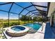 Inviting screened-in pool and spa with stunning golf course views at 225 Pesaro Dr, North Venice, FL 34275