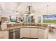 Island kitchen with granite countertops and views of the golf course at 225 Pesaro Dr, North Venice, FL 34275