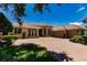Two-story home with a brick driveway and two car garage at 225 Pesaro Dr, North Venice, FL 34275