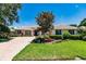 Single-story home with brick driveway and lush landscaping at 225 Pesaro Dr, North Venice, FL 34275