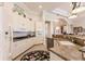 Well-equipped kitchen with white cabinets, granite countertops, and stainless steel appliances at 225 Pesaro Dr, North Venice, FL 34275