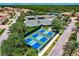 Aerial view of community pickleball and tennis courts at 225 Pesaro Dr, North Venice, FL 34275