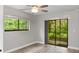 Spacious bedroom with sliding glass doors and tranquil views at 11702 Raintree Village Blvd # A, Temple Terrace, FL 33617