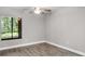 Bright bedroom with large window and ceiling fan at 11702 Raintree Village Blvd # A, Temple Terrace, FL 33617