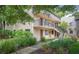 Two story building exterior with lush landscaping at 11702 Raintree Village Blvd # A, Temple Terrace, FL 33617