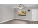 Living room with ceiling fan and window at 11702 Raintree Village Blvd # A, Temple Terrace, FL 33617