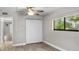 Well-lit bedroom with ample closet space and ceiling fan at 11702 Raintree Village Blvd # A, Temple Terrace, FL 33617