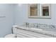 Updated bathroom with granite countertop vanity at 11702 Raintree Village Blvd # A, Temple Terrace, FL 33617