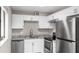 Modern kitchen featuring stainless steel appliances and granite countertops at 11702 Raintree Village Blvd # A, Temple Terrace, FL 33617