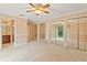 Large bedroom with mirrored closet doors and access to a bathroom at 2925 W Sligh Ave, Tampa, FL 33614