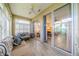 Bright sunroom offers ample natural light and access to the backyard at 1940 Inverness Greens Dr # 1940, Sun City Center, FL 33573