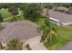 Aerial view of single-story home with landscaped yard at 1940 Inverness Greens Dr # 1940, Sun City Center, FL 33573