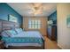 Spacious bedroom with a king-size bed, ceiling fan, and neutral decor at 1940 Inverness Greens Dr # 1940, Sun City Center, FL 33573