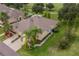 Aerial view of single-story home with landscaped yard at 1940 Inverness Greens Dr # 1940, Sun City Center, FL 33573