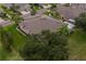 Aerial view of single-story home with landscaped yard at 1940 Inverness Greens Dr # 1940, Sun City Center, FL 33573