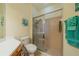 Bathroom with a shower stall, toilet, and plenty of storage at 1940 Inverness Greens Dr # 1940, Sun City Center, FL 33573