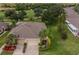 Aerial view of single-story home with landscaped yard at 1940 Inverness Greens Dr # 1940, Sun City Center, FL 33573