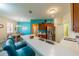 Modern kitchen with stainless steel appliances and a breakfast bar at 1940 Inverness Greens Dr # 1940, Sun City Center, FL 33573