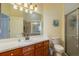 Clean bathroom with a walk-in shower, vanity with sink, and toilet at 1940 Inverness Greens Dr # 1940, Sun City Center, FL 33573