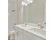 Double vanity bathroom with white cabinets and a shower at 149 Hidden Estates Ct, Brandon, FL 33511