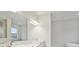 Bathroom with double vanity, large mirror, and modern lighting at 149 Hidden Estates Ct, Brandon, FL 33511