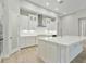 White kitchen with quartz countertops and stainless steel appliances at 149 Hidden Estates Ct, Brandon, FL 33511