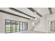Light-filled living area with sliding glass doors and wood beams at 149 Hidden Estates Ct, Brandon, FL 33511