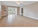 Living room with tile floors, view to backyard, and ceiling fan at 1920 Cedar Run Ct, Plant City, FL 33563