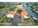 An aerial view of updated condos, new parking lot, and beautiful water access to the bay and ocean at 6504 Abaco Dr # 101, Apollo Beach, FL 33572