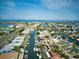 Panoramic aerial view of a coastal community with winding canals, lush landscaping, and access to open water at 6504 Abaco Dr # 101, Apollo Beach, FL 33572