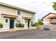 Two-story building with a shared parking area and lush landscaping at 6504 Abaco Dr # 101, Apollo Beach, FL 33572