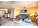 Comfortable living room featuring a sectional sofa and large windows at 6504 Abaco Dr # 101, Apollo Beach, FL 33572