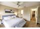Spacious bedroom with a king-size bed and ensuite bathroom access at 6504 Abaco Dr # 101, Apollo Beach, FL 33572
