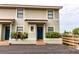 Two-story building with a shared parking area and lush landscaping at 6504 Abaco Dr # 101, Apollo Beach, FL 33572