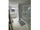 Modern bathroom with a large walk-in shower, double vanity, and tile floors at 3435 S Bayshore E Blvd # 400, Tampa, FL 33629